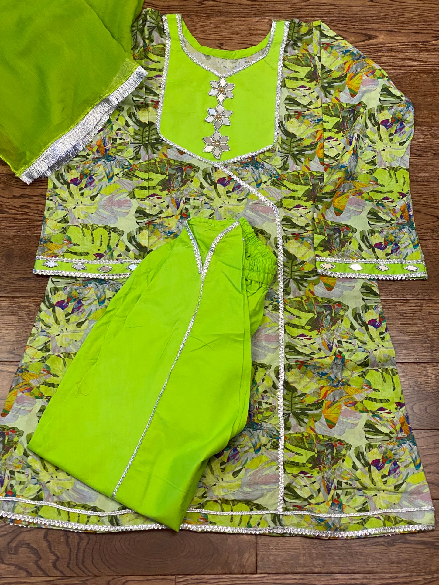 Green lawn printed airline shirt with tulip shelwar bodered with silver lace and beautiful green net dupatta