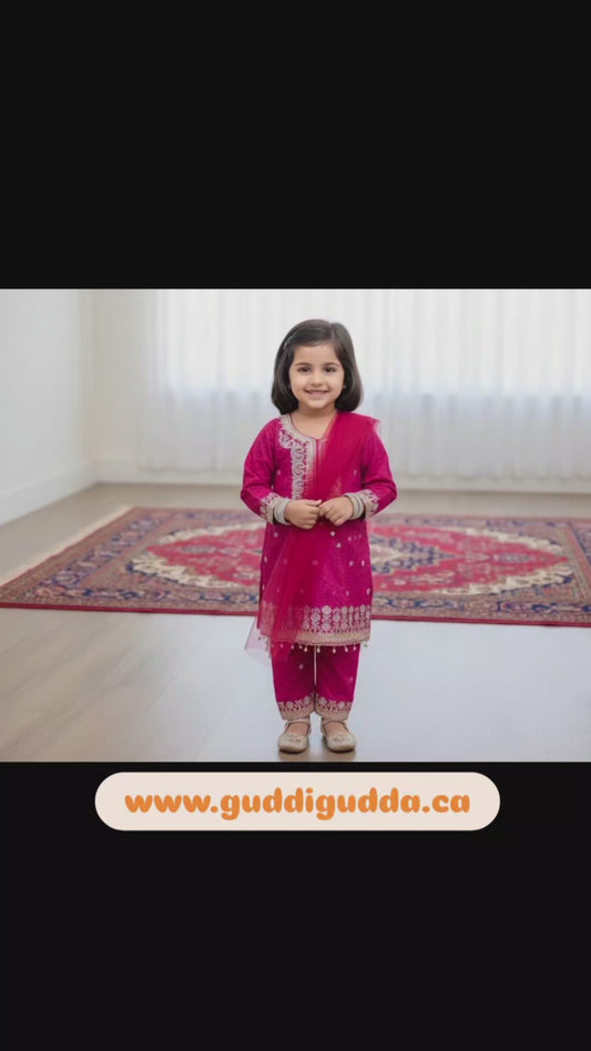 A girls' pink cotton kurta featuring a self-print and embroidery, paired with matching pants and a net dupatta.