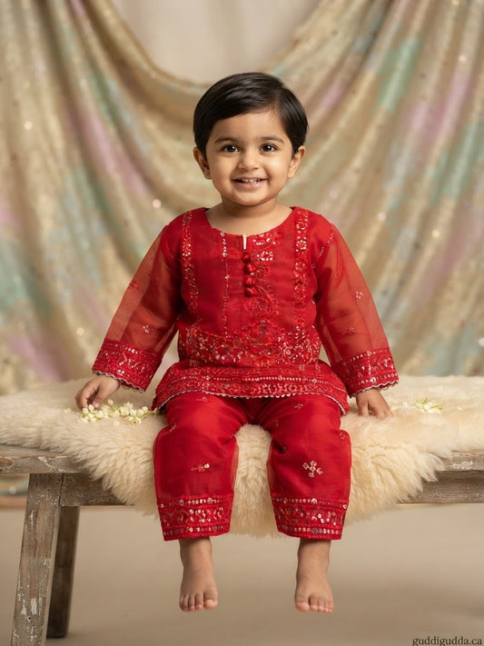 Girls Vibrant red  traditional kurta and pants set featuring intricate tonal embroidery, sequin work, and sheer sleeves.