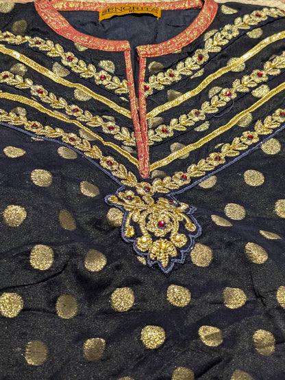 Infant sharara set featuring a navy blue polka-dot kurta paired with a pink and gold jacquard flared bottom and net duapatta