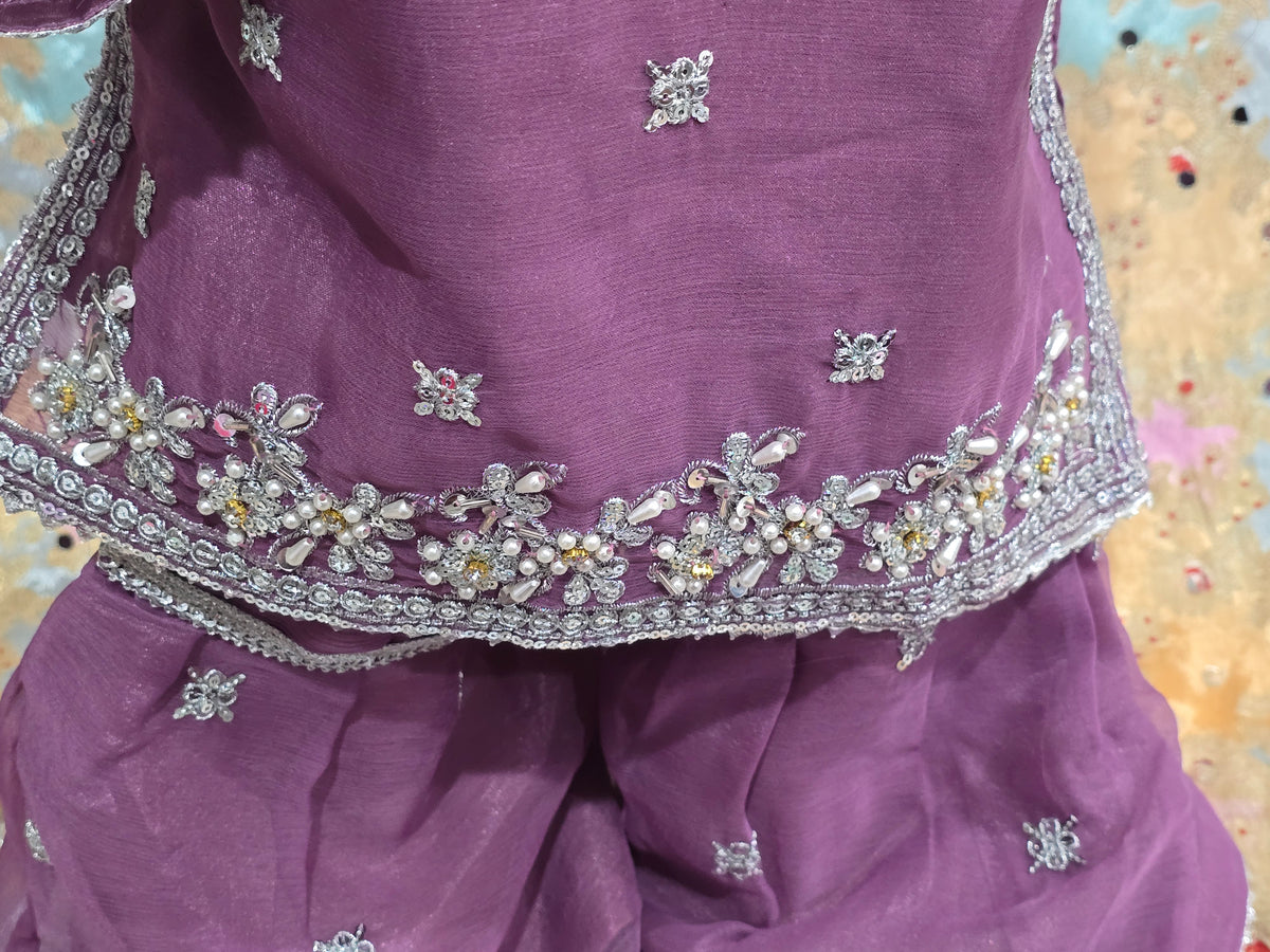 Girls Mauve Embroidered 3-Piece Set: Organza kurta with a pearl-beaded yoke, matching embroidered gharara  and a lightweight dupatta.