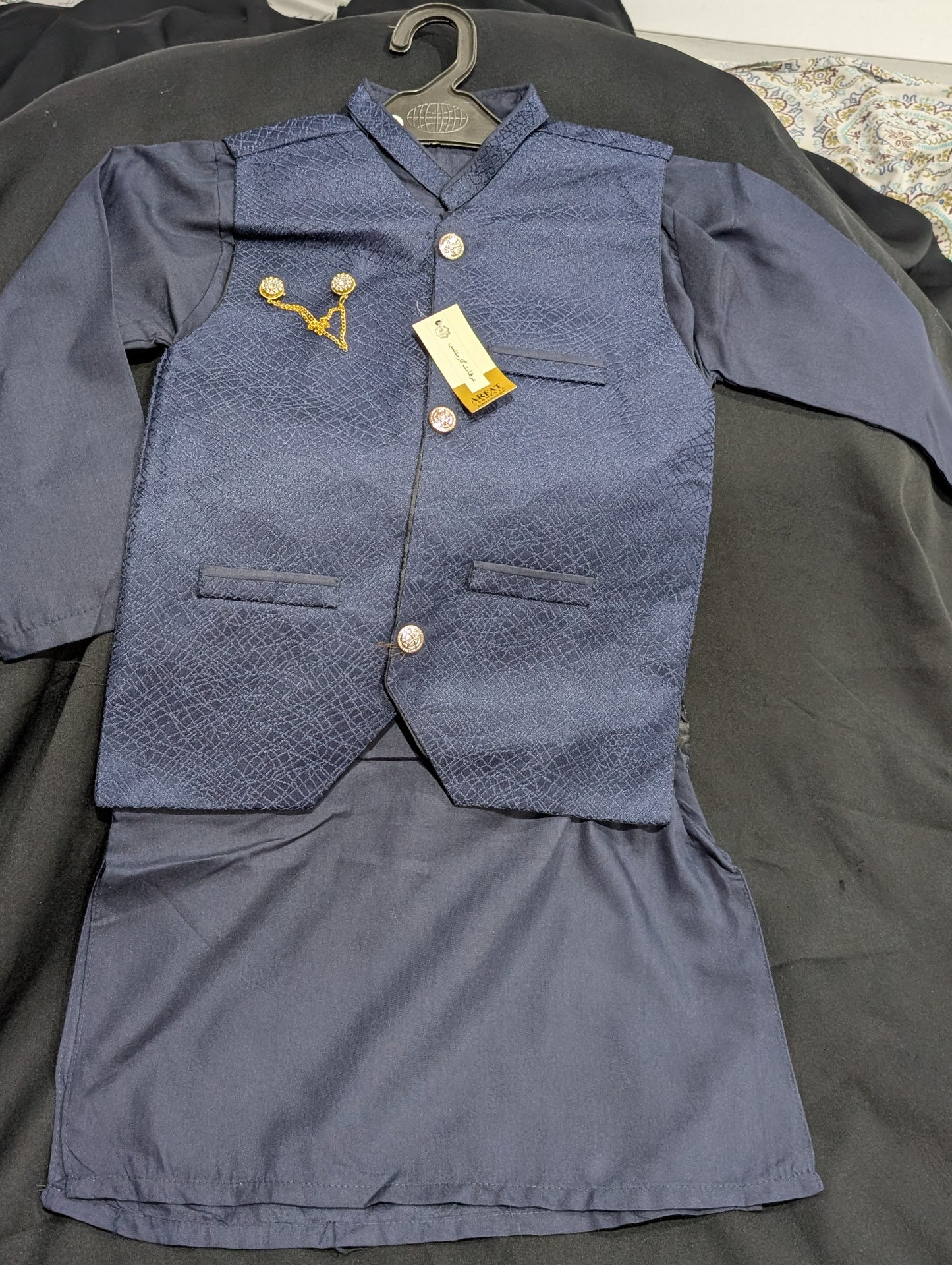 Boys' dusty blue kurta pajama set with a patterned waistcoat.