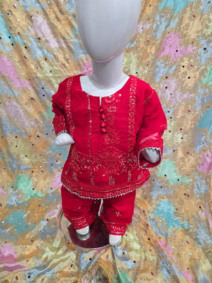 Girls Vibrant red  traditional kurta and pants set featuring intricate tonal embroidery, sequin work, and sheer sleeves.