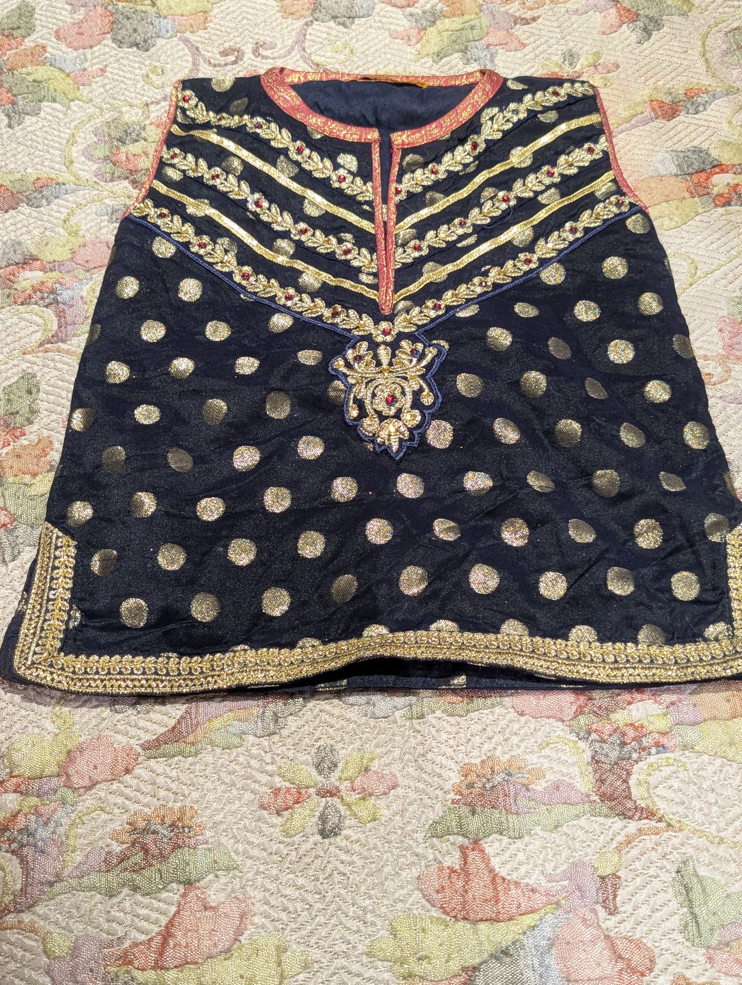Infant sharara set featuring a navy blue polka-dot kurta paired with a pink and gold jacquard flared bottom and net duapatta