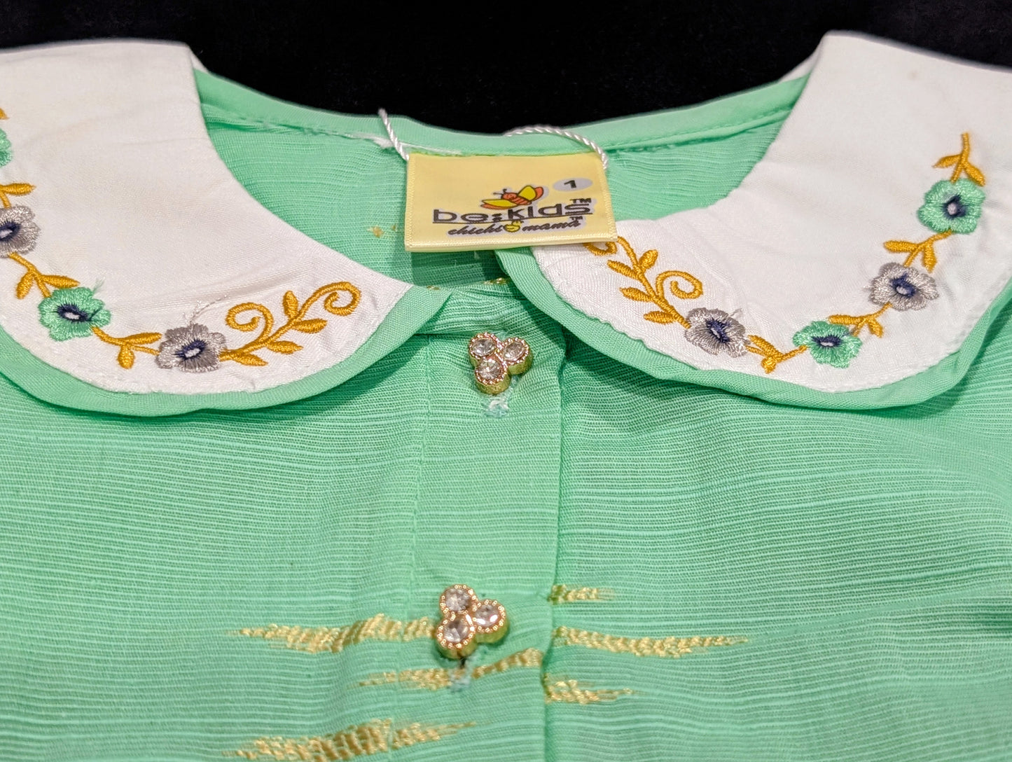 Self-printed and embroidered frocks and pants for baby girls.