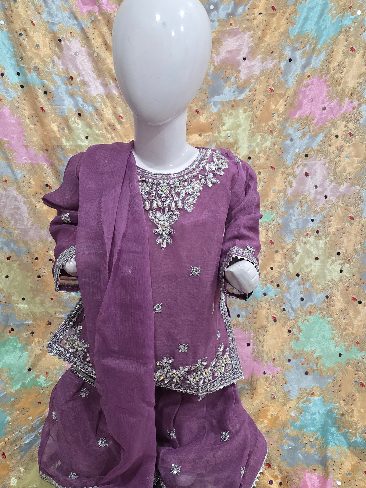 Girls Mauve Embroidered 3-Piece Set: Organza kurta with a pearl-beaded yoke, matching embroidered gharara  and a lightweight dupatta.