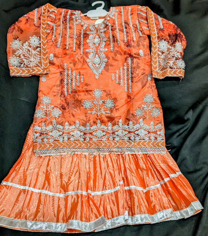 Girls' chiffon shirts featuring embroidery, self-print, and stylish sleeves, paired with a crushed gharara and net dupatta.