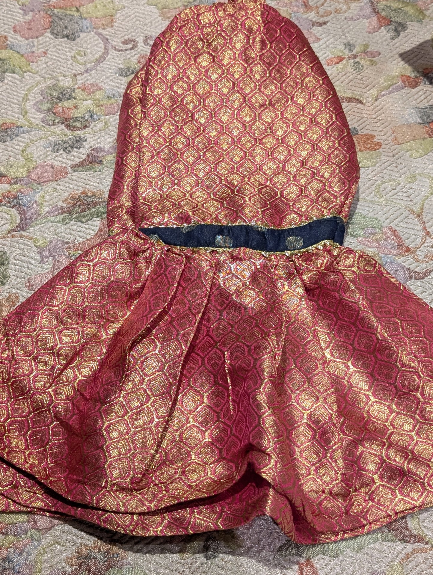Infant sharara set featuring a navy blue polka-dot kurta paired with a pink and gold jacquard flared bottom and net duapatta